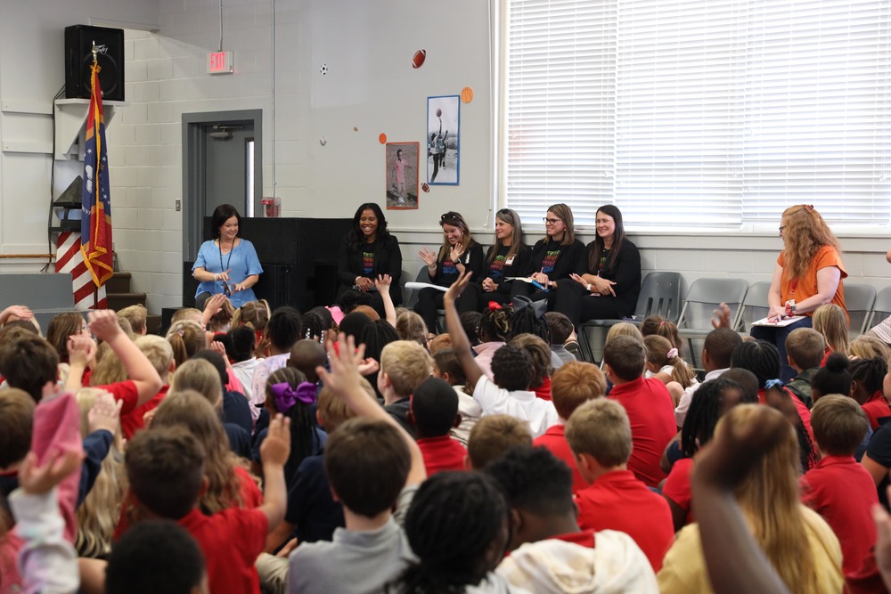 Students sitting in the auditorium during the MDE presentation
